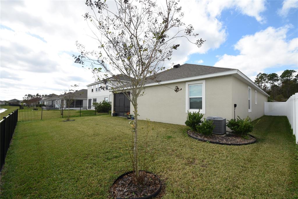 59 Oakleaf Way Palm Coast, FL 32137 - Photo 39 of 39 a front view of house with garden