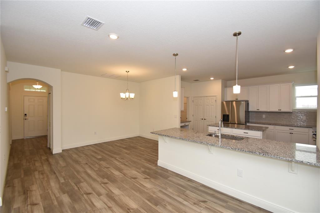 59 Oakleaf Way Palm Coast, FL 32137 - Photo 6 of 39 a view of a kitchen with a sink and center island