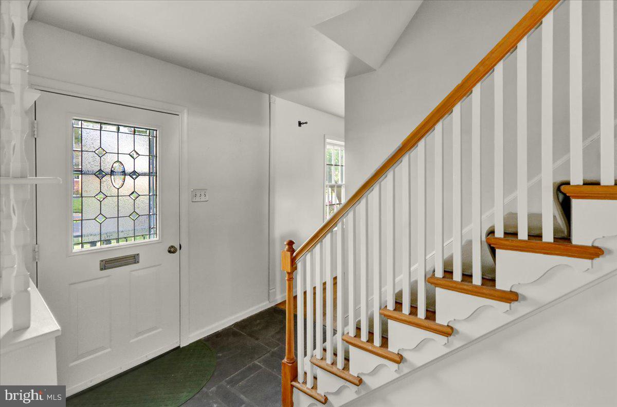 2701 Dalin Drive Reading, PA 19609 - Photo 12 of 34 a view of staircase with lots of frames on wall and windows