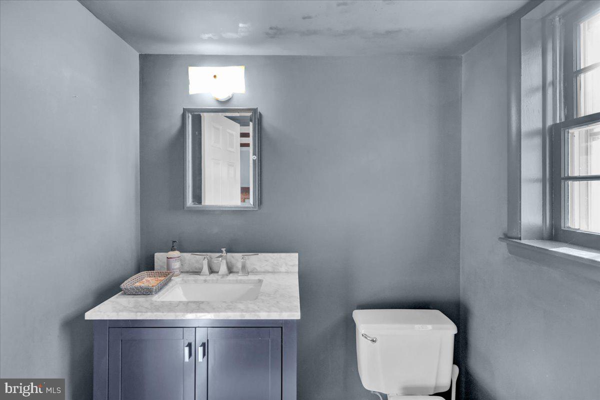 2701 Dalin Drive Reading, PA 19609 - Photo 14 of 34 a bathroom with a toilet sink and mirror