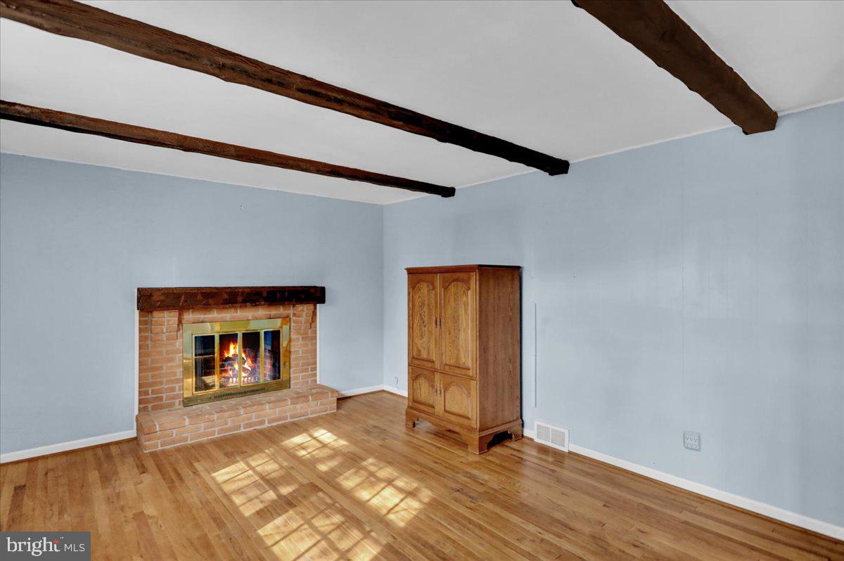 2701 Dalin Drive Reading, PA 19609 - Photo 15 of 34 a bedroom with a bed and a fireplace