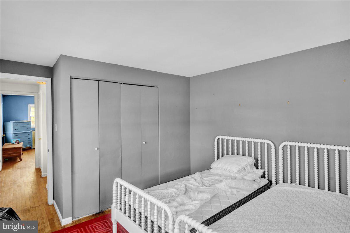 2701 Dalin Drive Reading, PA 19609 - Photo 32 of 34 a bedroom with a bed and wooden floor