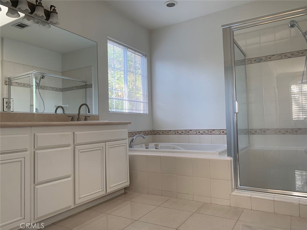 359 California Street Arcadia, CA 91006 - Photo 11 of 24 a bathroom with a granite countertop sink and a mirror