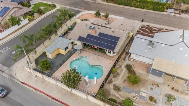 an aerial view of a house with outdoor space
