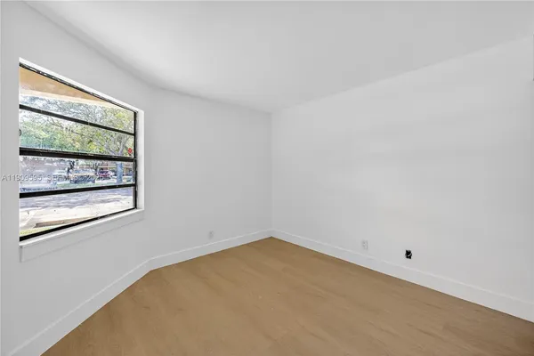 a view of a room that has a window in it