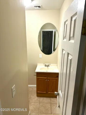 a bathroom with a sink and mirror