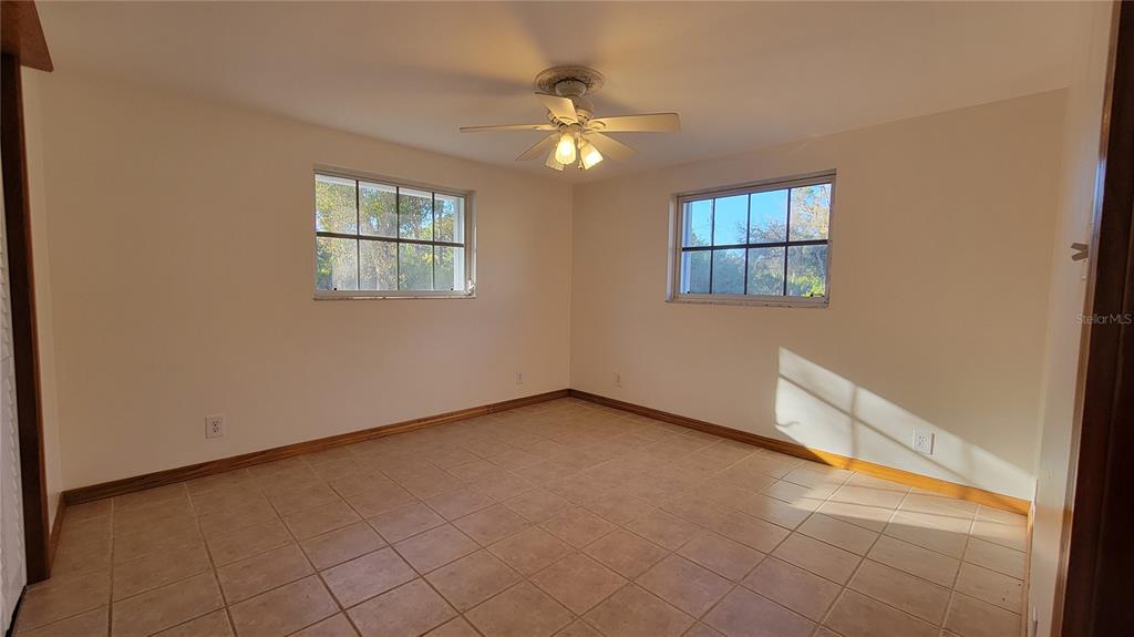 5847 Venisota Road Venice, FL 34293 - Photo 15 of 29 a view of an empty room with a window