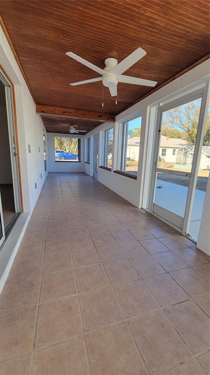 5847 Venisota Road Venice, FL 34293 - Photo 19 of 29 a view of an empty room with a fireplace and a window