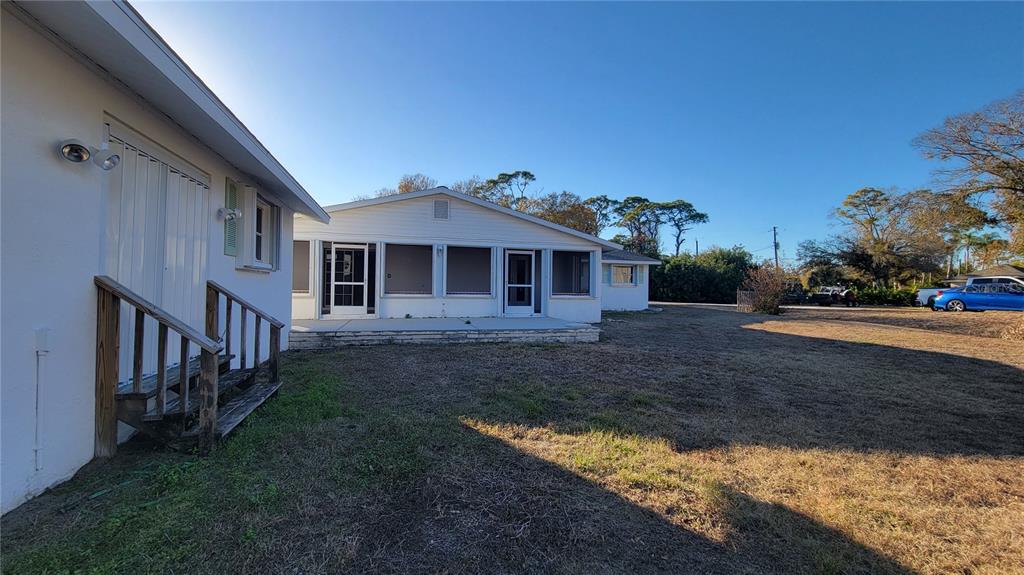 5847 Venisota Road Venice, FL 34293 - Photo 21 of 29 a front view of a house with a yard