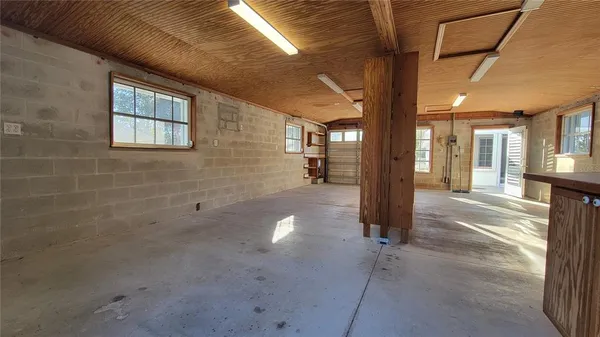 a view of a hallway with wooden shelves