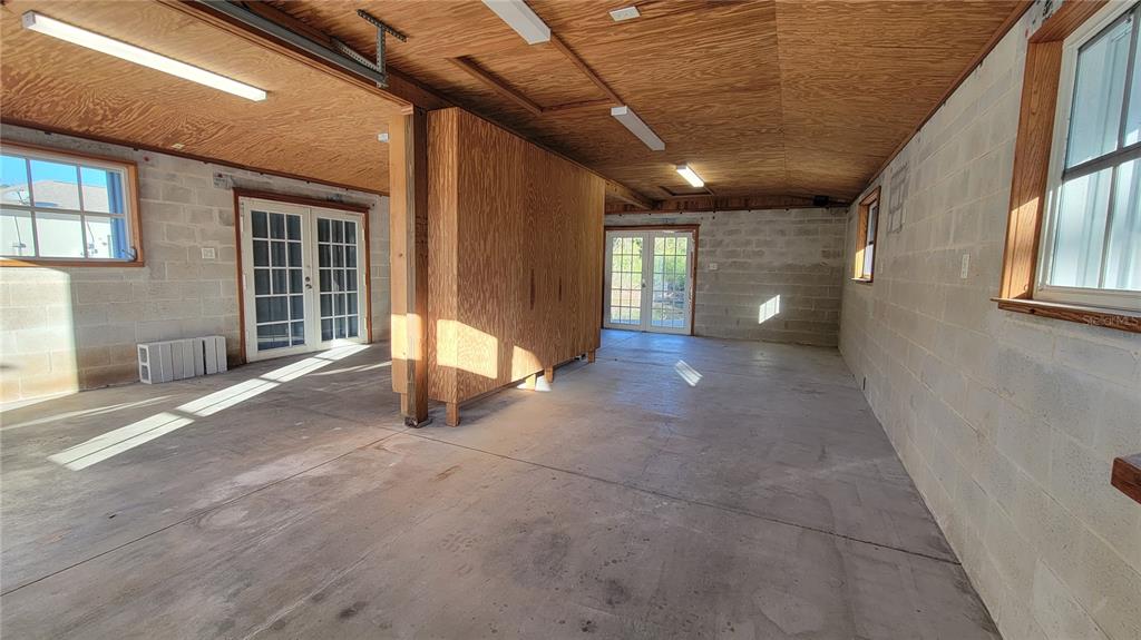 5847 Venisota Road Venice, FL 34293 - Photo 25 of 29 a view of a hallway with wooden floor and fence