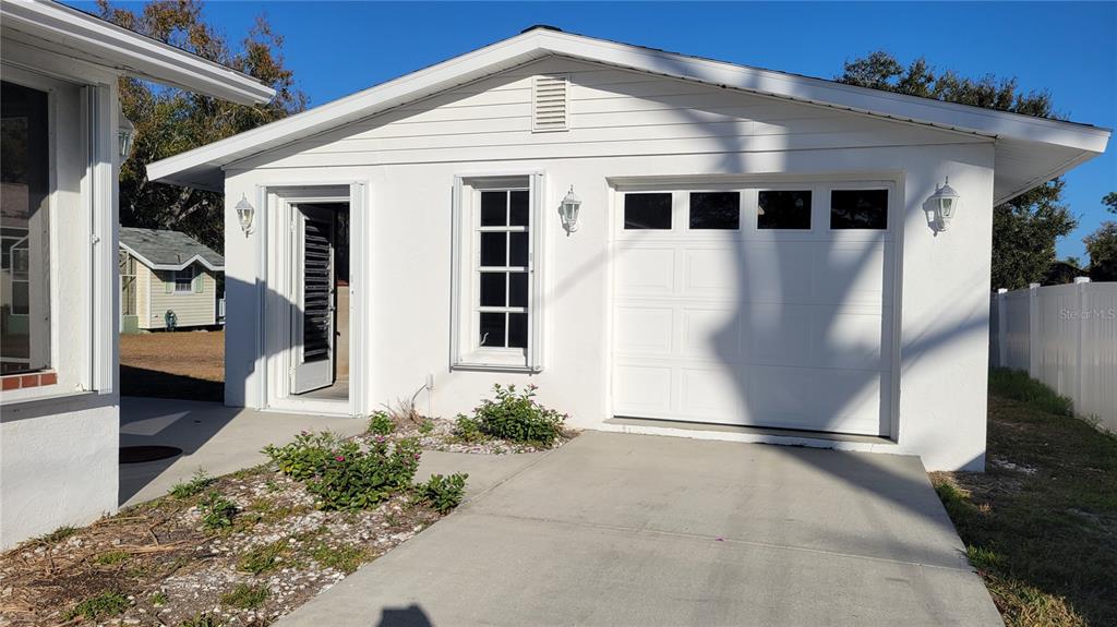 5847 Venisota Road Venice, FL 34293 - Photo 4 of 29 a front view of a house with a yard