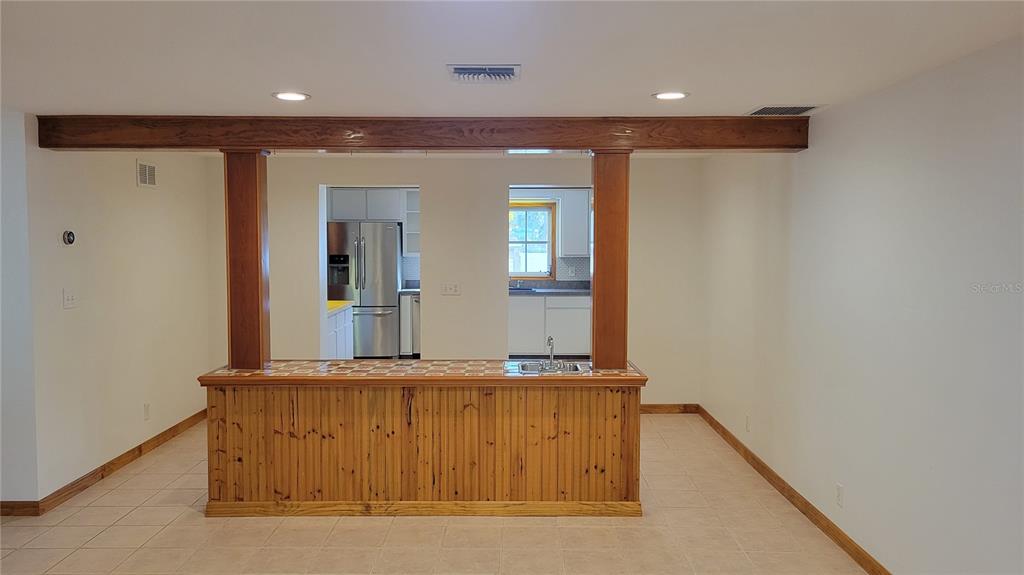 5847 Venisota Road Venice, FL 34293 - Photo 8 of 29 a view of a hallway with wooden floor and staircase