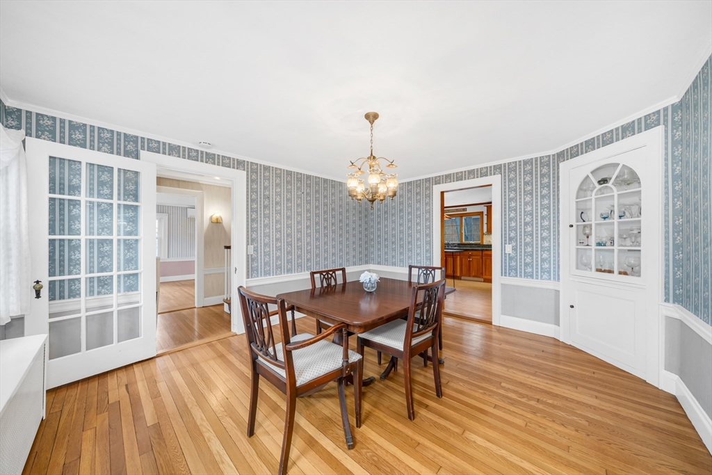 293 Florence Road Waltham, MA 02453 - Photo 11 of 41 a view of a dining room with furniture window and wooden floor