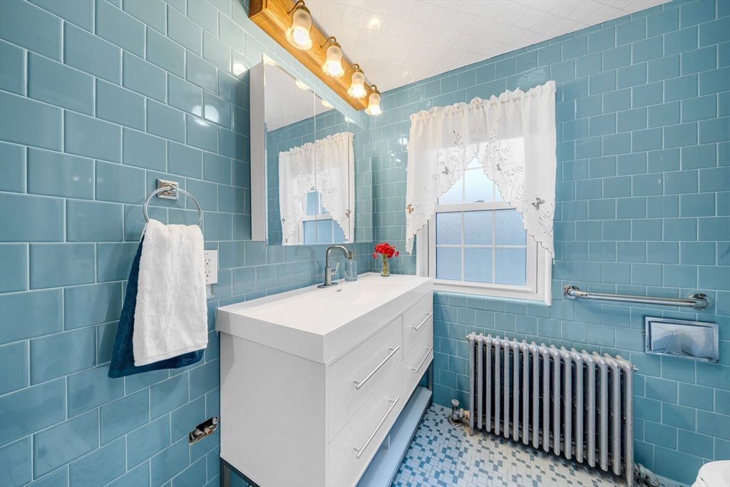 293 Florence Road Waltham, MA 02453 - Photo 13 of 41 a bathroom with a sink and a mirror