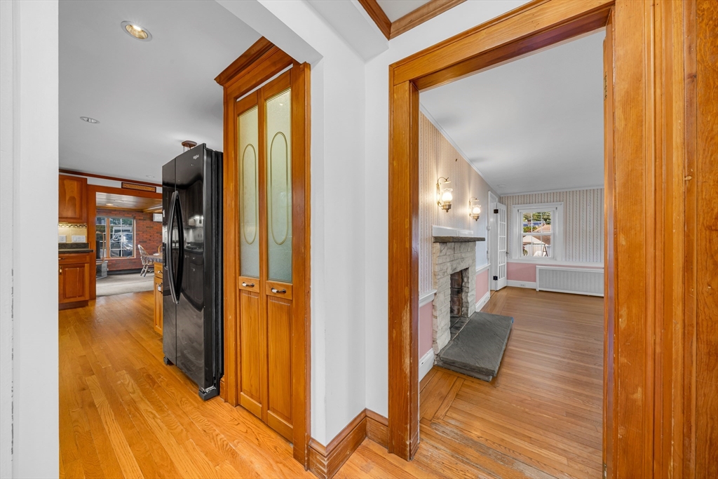 293 Florence Road Waltham, MA 02453 - Photo 15 of 41 a view of a hallway and a livingroom with furniture