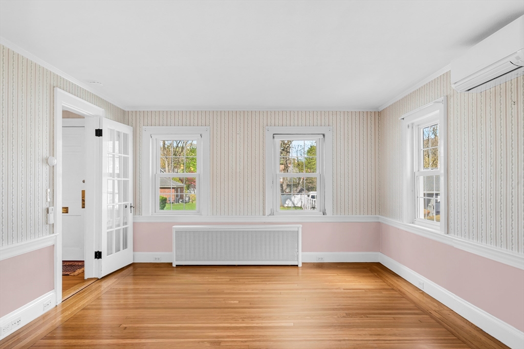 293 Florence Road Waltham, MA 02453 - Photo 17 of 41 an empty room with wooden floor and windows