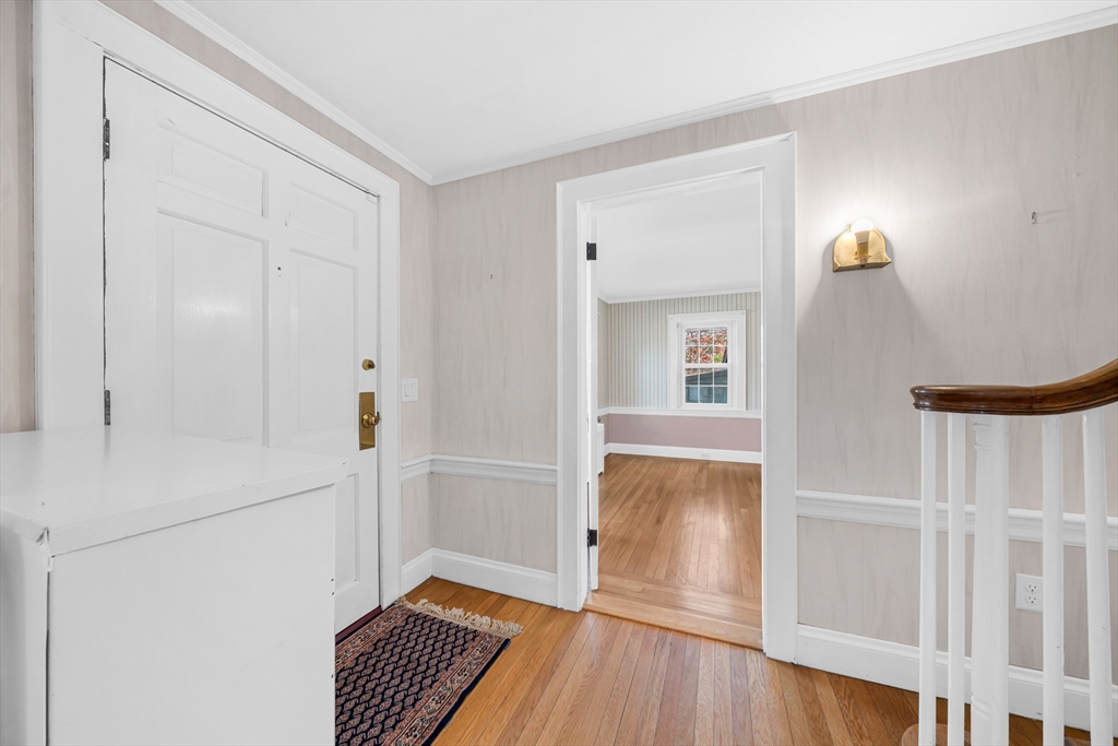 293 Florence Road Waltham, MA 02453 - Photo 18 of 41 a view of an empty room with wooden floor and a window