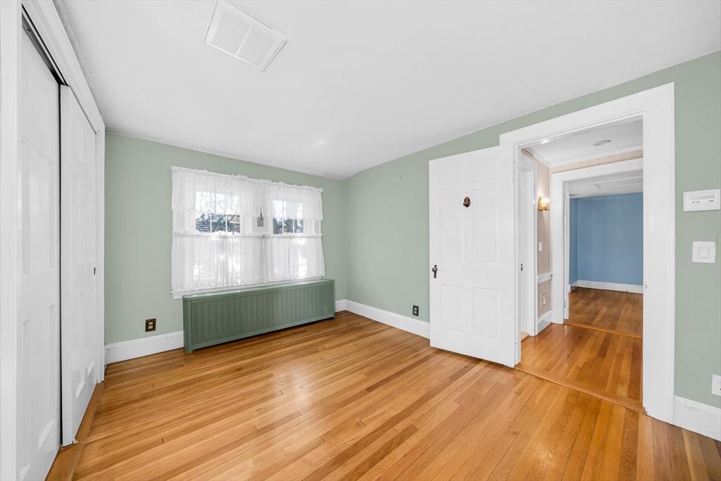 293 Florence Road Waltham, MA 02453 - Photo 24 of 41 a bedroom with a bed and a window