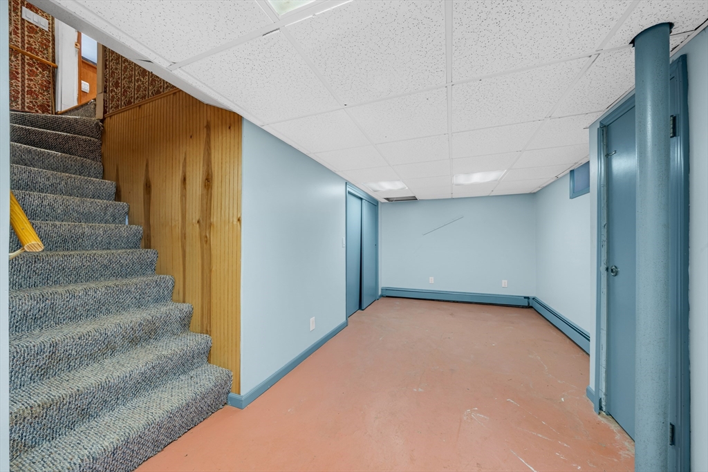 293 Florence Road Waltham, MA 02453 - Photo 35 of 41 a view of an empty room with stairs