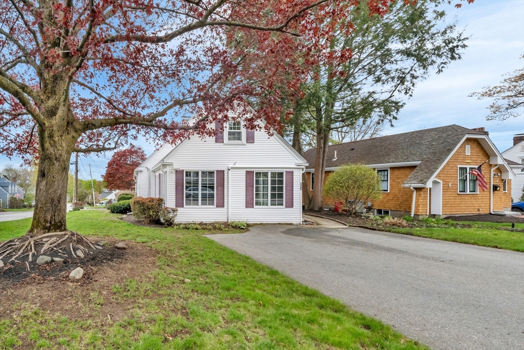293 Florence Road Waltham, MA 02453 - Photo 40 of 41 a front view of a house with a garden and trees