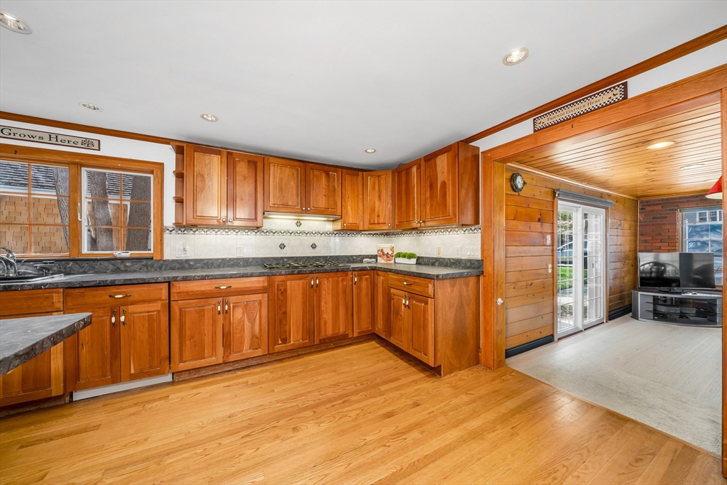 293 Florence Road Waltham, MA 02453 - Photo 7 of 41 a kitchen with stainless steel appliances granite countertop a stove a sink and a refrigerator