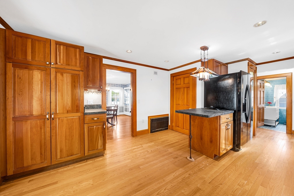 293 Florence Road Waltham, MA 02453 - Photo 8 of 41 a living room with stainless steel appliances furniture and a flat screen tv