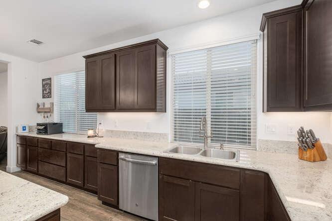 3822 Hannah Lane Clovis, CA 93619 - Photo 11 of 26 a kitchen with a sink cabinets and window