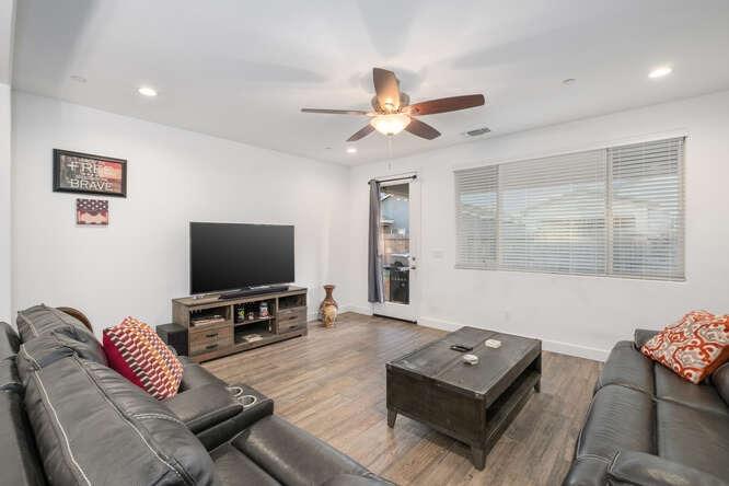 3822 Hannah Lane Clovis, CA 93619 - Photo 16 of 26 a living room with furniture and a flat screen tv