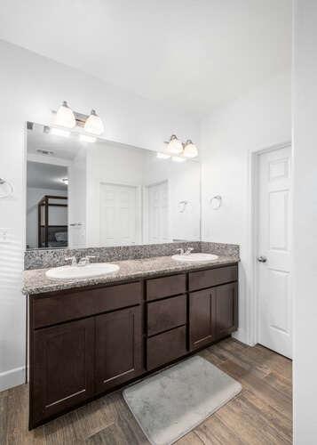 3822 Hannah Lane Clovis, CA 93619 - Photo 19 of 26 a bathroom with a granite countertop sink and a mirror