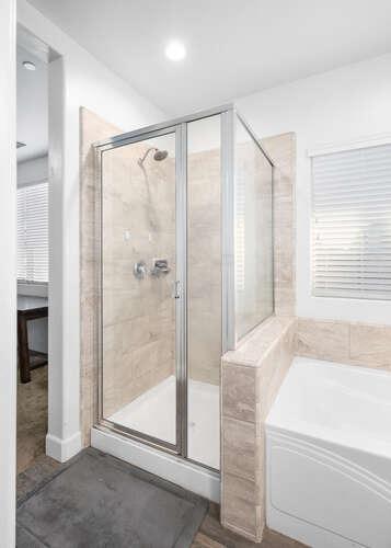 3822 Hannah Lane Clovis, CA 93619 - Photo 20 of 26 a bathroom with a bathtub and a shower