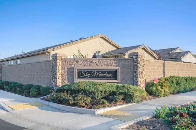 3822 Hannah Lane Clovis, CA 93619 - Photo 2 of 26 a view of a street with a building in front of it