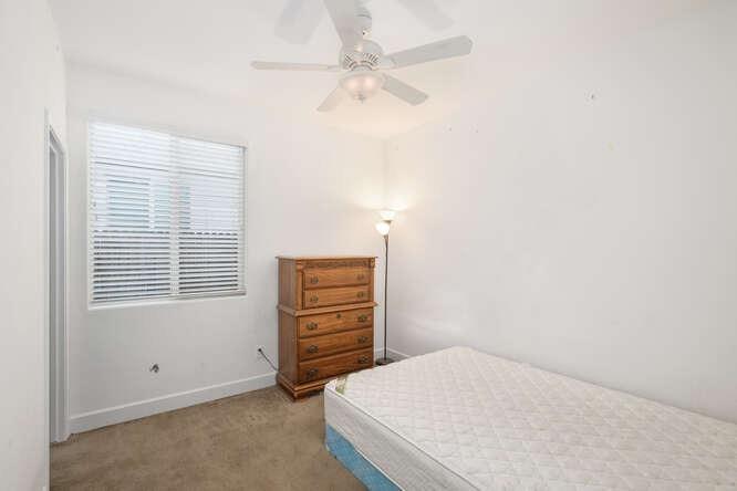 3822 Hannah Lane Clovis, CA 93619 - Photo 22 of 26 an empty room with a window and a ceiling fan