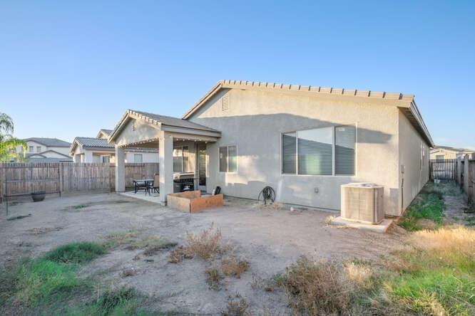 3822 Hannah Lane Clovis, CA 93619 - Photo 26 of 26 a view of a house with backyard and porch