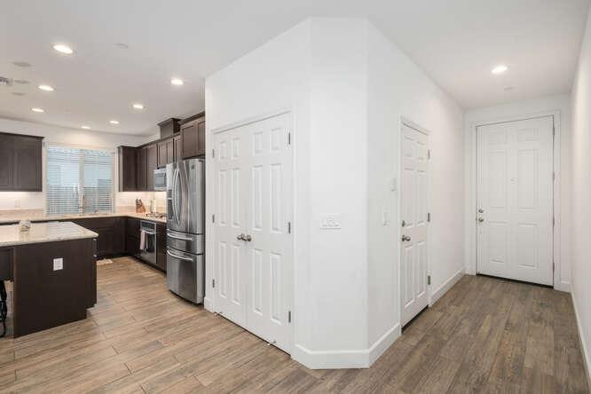 3822 Hannah Lane Clovis, CA 93619 - Photo 7 of 26 a view of a kitchen with wooden floor and electronic appliances