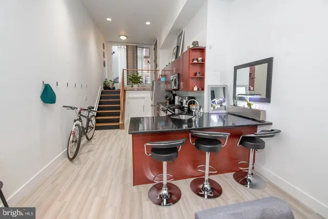 a room with furniture and wooden floor