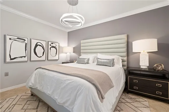 a bedroom with a bed and a lamp on table