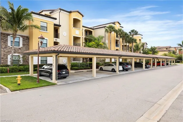 a view of a building with a swimming pool and porch