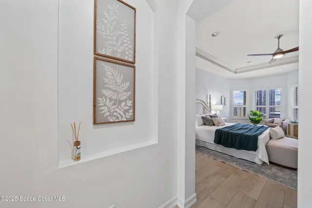 a spacious bathroom with a tub sink and mirror