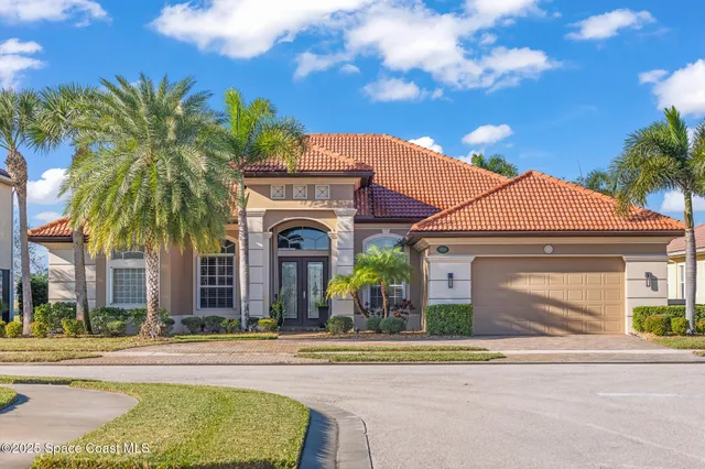 a living room with furniture and a dining table with wooden floor