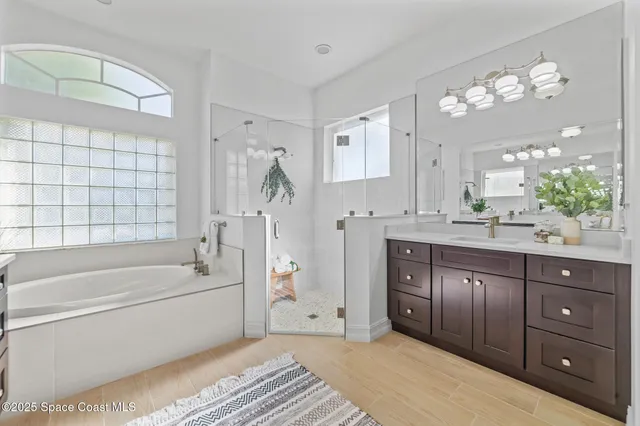 a utility room with sink dryer and washer