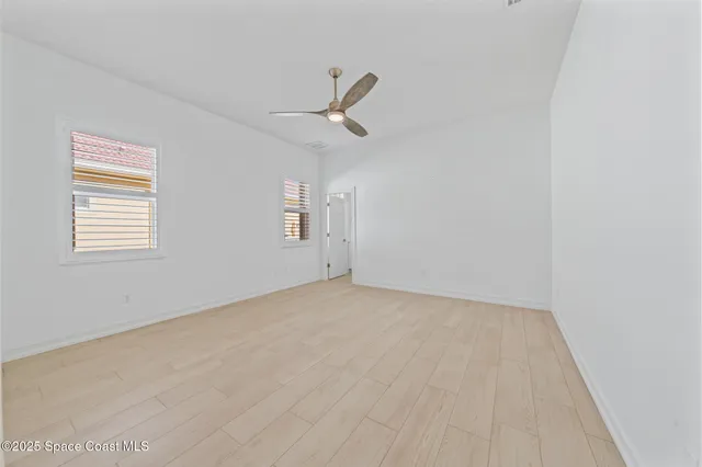 a view of residential houses with outdoor space and ocean view