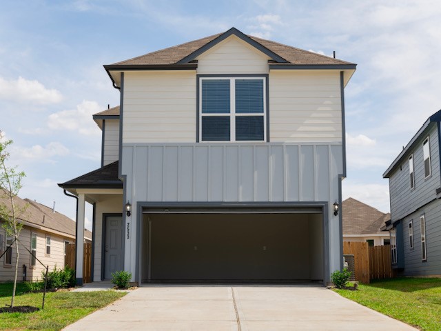 2533 Sturgeon Way Conroe, TX 77384 - Photo 1 of 30 a front view of a house with a garden