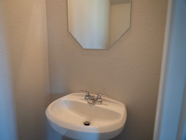 2533 Sturgeon Way Conroe, TX 77384 - Photo 11 of 30 a bathroom with a sink and a mirror