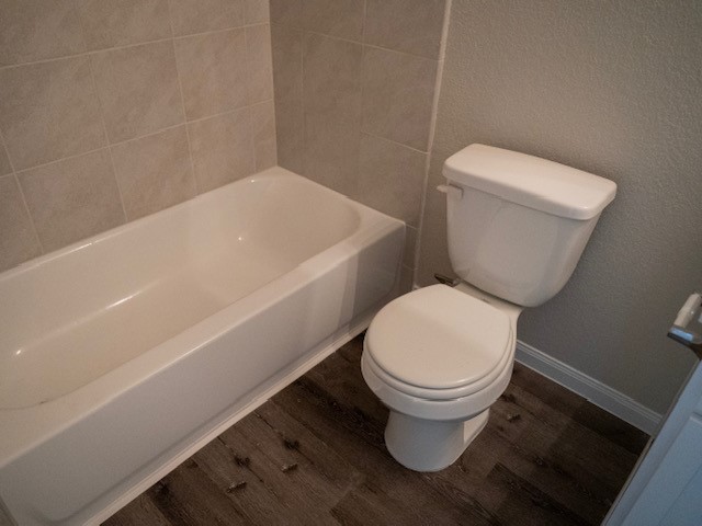 2533 Sturgeon Way Conroe, TX 77384 - Photo 20 of 30 a white toilet sitting next to a white wall