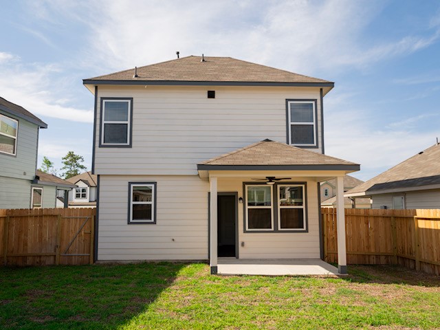 2533 Sturgeon Way Conroe, TX 77384 - Photo 26 of 30 a front view of a house with a yard