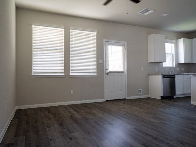 2533 Sturgeon Way Conroe, TX 77384 - Photo 3 of 30 a view of an empty room with wooden floor and a window