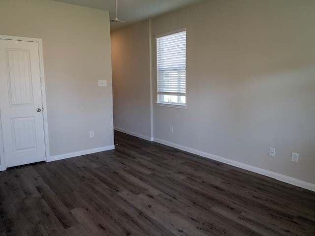 2533 Sturgeon Way Conroe, TX 77384 - Photo 8 of 30 a view of an empty room with wooden floor and a window