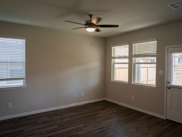 2533 Sturgeon Way Conroe, TX 77384 - Photo 10 of 30 an empty room with wooden floor fan and windows
