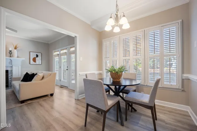 a kitchen with granite countertop a sink a counter top space a stove and cabinets